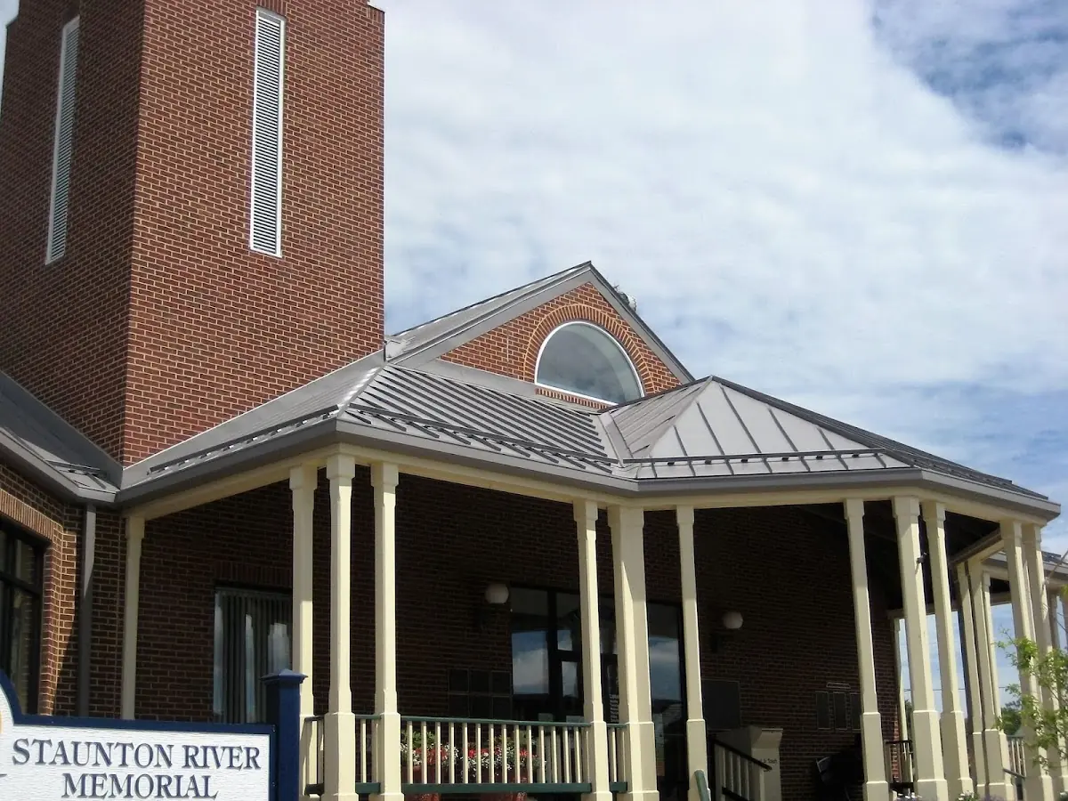 Skilled roofing craftsmen working on a residential roof in Perrysburg